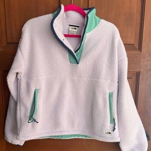 The North Face women’s size small fleece pullover. Lavender and teal.